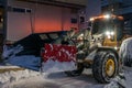 Powerful snowplough clearing residential roads