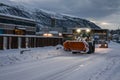 Powerful snowplough clearing residential roads