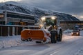 Powerful snowplough clearing residential roads