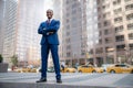 Powerful stance portrait of a successful and accomplished African American CEO businessman, in financial district with city skyscr Royalty Free Stock Photo
