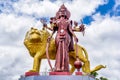 A powerful Statue of the Hindu goddess Durga Maa with a golden lion in sacred Ganga Talao. Grand bassin crater lake Royalty Free Stock Photo