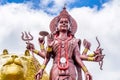 A powerful Statue of the Hindu goddess Durga Maa with a golden lion in sacred Ganga Talao. Grand bassin crater lake Royalty Free Stock Photo