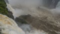 A powerful stream of water collapsing into a raging river