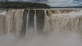 The powerful streams of the waterfall collapse into the abyss. Royalty Free Stock Photo