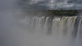 The powerful streams of the waterfall collapse from the edge of the ledge