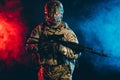Soldier man in uniform pointing rifle isolated over smoky space Royalty Free Stock Photo