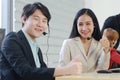 Powerful and Successful of Business people Call Center and technical Support staff. Receptionist phone operators teamwork. Asian Royalty Free Stock Photo