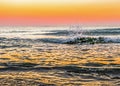 Powerful sunrise at the rocky shore