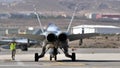 Powerful supersonic fighter plane with two jet engines seen from behind