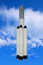 Powerful three-stage, with 5 engines in the first stage, a rocket launcher with a spaceship. Royalty Free Stock Photo