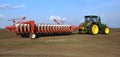 Powerful tractor transports 18 row multipurpose seed drill