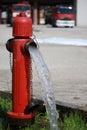 powerful water flow coming out with impetus from a street red hydrant