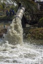 Powerful water flowing from a large pipe using a water pump supp