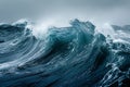 A powerful wave crashes against rocky cliffs in the ocean on a cloudy day, creating a dramatic display of water spray and foam,