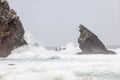 Powerful waves crash on the rocks at Praia da Adraga, Portugal