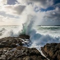 Powerful waves create a dramatic scene under a mostly cloudy sky with Royalty Free Stock Photo