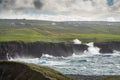 Powerful waves crushing against Cliffs and rough stone coastline of West coast of Ireland. Doolin area. County Clare. Ocean power Royalty Free Stock Photo