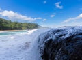 Powerful waves flow over rocks at Lumahai Beach, Kauai