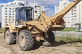 Powerful wheel loader for transporting bulky goods at the construction site of a modern residential area. Construction equipment Royalty Free Stock Photo