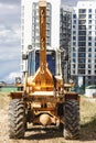 Powerful wheel loader for transporting bulky goods at the construction site of a modern residential area. Construction equipment Royalty Free Stock Photo