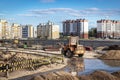 Powerful wheel loader for transporting bulky goods at the construction site of a modern residential area. Construction equipment Royalty Free Stock Photo