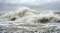 Powerful winds whip up the waves as the storm surge makes its way towards the shore threatening to engulf everything in