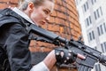 Powerful Woman Holding Gun. War Action Movie Style