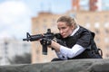 Powerful Woman Holding Gun. War Action Movie Style