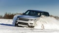 Powerful 4x4 offroader car running on snow field Royalty Free Stock Photo