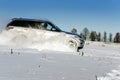 Powerful 4x4 offroader car running on snow field