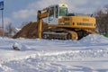 Poland Ostrowiec Swietokrzyski December 4, 2023 at 12:06. A large Liebherr excavator is digging the ground in snowy conditions.