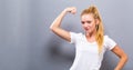 Powerful young fit woman flexing Royalty Free Stock Photo