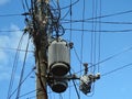 Powerline insulators, connectors, transformers and tangled wires Royalty Free Stock Photo