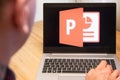 PowerPoint is used by a man on the laptop. Microsoft customer used computer software. New product is tested by IT specialist