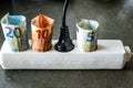 Powerstrip with plugs and Euro banknotes to illustrate the rise of electricity and daily life expenses Royalty Free Stock Photo