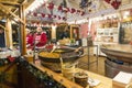 Two saleswomen in a Christmas kiosk with selling hot food. Christmas market in Poznan. Poland Royalty Free Stock Photo