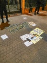 Yellow and blue tulip flowers and protest banners says: NO WAR near Embassy of Russia in Poland.