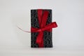 Poznan, Poland - 06.03.2023: Gift wrapping of perfume with a red bow from the Douglas store