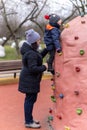 Woman and child by a climb wall