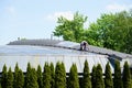 Man working on a roof in the old zoo in Poznan, Poland Royalty Free Stock Photo