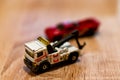 POZNAN, POLAND - Oct 13, 2020: Mattel Matchbox tow truck on wooden surface