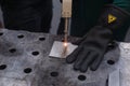 Cutting steel, plasma. A woman cuts steel with a plasma