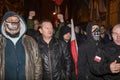 Nationalists, hooligans and fascists awaiting the Parliament Member Winnicki. On the other side of street people protesting agains Royalty Free Stock Photo