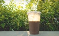 Pozol - Mexican chocolate corn drink in plastic cup with backlight