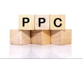 ppc text on wooden cubes on a white background. Business concept Royalty Free Stock Photo