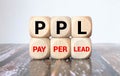 PPL - Pay per Lead - handwritten text in a notebook on a desk - on wooden block Royalty Free Stock Photo