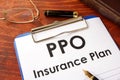 PPO Insurance Plan on a table.