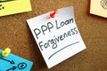 PPP loan forgiveness memo on the board. Royalty Free Stock Photo