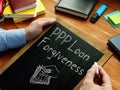 PPP Loan Forgiveness is shown on the conceptual business photo Royalty Free Stock Photo