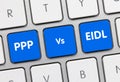 PPP Vs EIDL - Inscription on Blue Keyboard Key